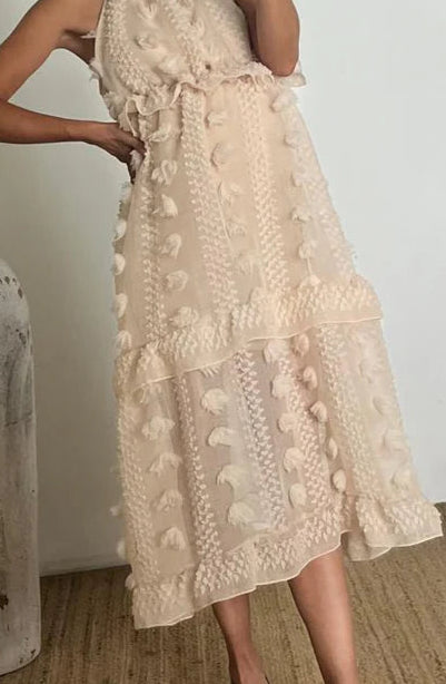 Tela beige pompones