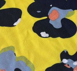 Yellow Polyester fabric with blue flowers